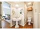 Bathroom with hardwood floors and vintage sink at 910 Old Orchard Rd, Chapel Hill, NC 27517