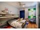 Comfortable bedroom with bunk beds, colorful decor, and natural light from the window at 910 Old Orchard Rd, Chapel Hill, NC 27517