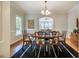 Elegant dining room featuring hardwood floors, a stylish rug, and classic wood furniture at 910 Old Orchard Rd, Chapel Hill, NC 27517
