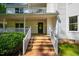 Welcoming front entrance with brick steps, a covered porch, and a classic front door, offering curb appeal and charm at 910 Old Orchard Rd, Chapel Hill, NC 27517