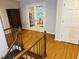 Hallway with wooden stairs and french doors at 910 Old Orchard Rd, Chapel Hill, NC 27517