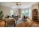 Cozy living room filled with natural light, featuring hardwood floors and comfortable seating at 910 Old Orchard Rd, Chapel Hill, NC 27517