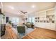 Inviting living room with a ceiling fan, and doors that lead to the back porch at 910 Old Orchard Rd, Chapel Hill, NC 27517