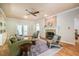 Comfortable living room with a ceiling fan, fireplace, and French doors at 910 Old Orchard Rd, Chapel Hill, NC 27517