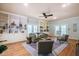 Cozy living room featuring built-in shelving, hardwood floors and outdoor access at 910 Old Orchard Rd, Chapel Hill, NC 27517