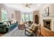Inviting living room boasting a fireplace, hardwood floors, and plenty of natural light at 910 Old Orchard Rd, Chapel Hill, NC 27517
