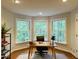 Bright home office featuring three large windows providing ample natural light at 910 Old Orchard Rd, Chapel Hill, NC 27517