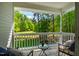 Relaxing screened-in porch offers views of the lush backyard and wooded area at 910 Old Orchard Rd, Chapel Hill, NC 27517