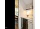 Stylish bar area with a wine fridge, modern shelving, and elegant lighting for entertaining at 921 Lily Claire Ln, Fuquay Varina, NC 27526