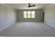 Spacious bedroom featuring natural light, crown moulding and a ceiling fan at 921 Lily Claire Ln, Fuquay Varina, NC 27526