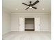 The bedroom features neutral walls and carpet, along with a ceiling fan and double doors leading to another room at 921 Lily Claire Ln, Fuquay Varina, NC 27526