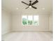 Bright bedroom features a ceiling fan, recessed lighting, and a large window that provides natural light at 921 Lily Claire Ln, Fuquay Varina, NC 27526