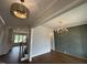 Bright dining room boasts wood floors, decorative chandelier, and a stylish accent wall at 921 Lily Claire Ln, Fuquay Varina, NC 27526