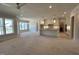 Open-concept kitchen with island, modern lighting, and view to breakfast area and great room at 921 Lily Claire Ln, Fuquay Varina, NC 27526