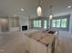 Spacious living room open to kitchen, featuring fireplace with built-ins, and large windows at 921 Lily Claire Ln, Fuquay Varina, NC 27526