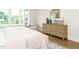 Bedroom with dresser, chair and view to back yard at 921 Lily Claire Ln, Fuquay Varina, NC 27526