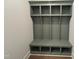 A mudroom area with a custom-built gray storage unit and bench, perfect for organization and convenience at 921 Lily Claire Ln, Fuquay Varina, NC 27526