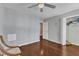 This bedroom offers a ceiling fan, hardwood floors, neutral paint and closet at 9332 Leslieshire Dr, Raleigh, NC 27615