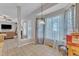 Bright dining area with large windows, neutral flooring, and seamless access to the living room at 9332 Leslieshire Dr, Raleigh, NC 27615
