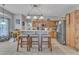 Eat-in kitchen featuring an island with bar stool seating, stainless steel appliances, and warm wood cabinets at 9332 Leslieshire Dr, Raleigh, NC 27615