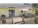 Wooden deck with outdoor dining set, providing an ideal space for entertainment and relaxation with sliding glass door entry at 10 Gray Bass Ct, Zebulon, NC 27597