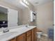 Bathroom boasts a double sink vanity with a full mirror and cabinet storage at 10 Gray Bass Ct, Zebulon, NC 27597