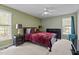 This spacious bedroom features natural light from two windows and a ceiling fan at 10 Gray Bass Ct, Zebulon, NC 27597