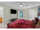 The large bedroom features a ceiling fan and tv mounted on the wall at 10 Gray Bass Ct, Zebulon, NC 27597