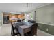 Dining area with a dining table, seating for six, and sliding glass doors leading to the outdoor space at 10 Gray Bass Ct, Zebulon, NC 27597