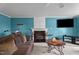 Living room with fireplace and television is perfect for entertaining guests at 10 Gray Bass Ct, Zebulon, NC 27597