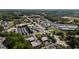 Expansive commercial area with warehouse storage buildings, offices, and ample parking amid lush green trees at 10 Shearin Ln, Youngsville, NC 27596