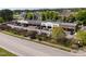 Aerial view of a red brick commercial building with parking and landscaping on a sunny day at 10 Shearin Ln, Youngsville, NC 27596