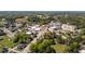 Commercial and residential area with a mix of buildings surrounded by green trees at 10 Shearin Ln, Youngsville, NC 27596