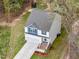 A high angle view of a well-maintained two-story home with an attached garage and well-kept lawn at 10 Shearin Ln, Youngsville, NC 27596