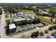 Aerial view of a large school complex with sports fields and parking, surrounded by trees at 10 Shearin Ln, Youngsville, NC 27596