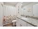 Stylish bathroom with granite countertops, decorative shower curtain, and modern fixtures at 10 Shearin Ln, Youngsville, NC 27596