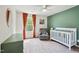 Bright Bedroom with a crib, comfortable chair, and plenty of natural light at 10 Shearin Ln, Youngsville, NC 27596