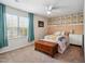Charming bedroom featuring a ceiling fan, bright window and floral accent wall at 10 Shearin Ln, Youngsville, NC 27596