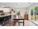 Bright dining area with hardwood floors, natural light, and access to the outdoor space at 10 Shearin Ln, Youngsville, NC 27596