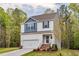 Charming two-story home with a two-car garage, landscaped yard, and inviting front porch at 10 Shearin Ln, Youngsville, NC 27596