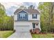 Inviting home with a neat lawn, a cozy front porch, and a convenient attached garage at 10 Shearin Ln, Youngsville, NC 27596