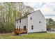 Exterior rear view of the two-story home with siding and a wood deck at 10 Shearin Ln, Youngsville, NC 27596