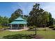 Picturesque gazebo in a park-like setting with lush greenery and clear blue skies at 10 Shearin Ln, Youngsville, NC 27596