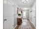 Neutral hallway featuring hardwood floors, and decorative mirrors, creating an inviting entry at 10 Shearin Ln, Youngsville, NC 27596