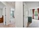 Hallway view leading to bedrooms and showcasing natural light and neutral tones at 10 Shearin Ln, Youngsville, NC 27596
