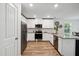Modern kitchen with stainless steel appliances, granite countertops, and ample cabinet space at 10 Shearin Ln, Youngsville, NC 27596