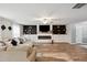Spacious living room featuring an entertainment center and hardwood floors at 10 Shearin Ln, Youngsville, NC 27596