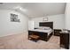 Spacious main bedroom featuring neutral walls, carpet, and a decorative elephant print at 10 Shearin Ln, Youngsville, NC 27596