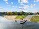Aerial view of the community boat ramp and sandy beach on the lake at 104 Chuckwagon Dr, Louisburg, NC 27549