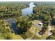 Scenic aerial view of lakefront community with boat docks, playground, parking, and recreational facilities at 104 Chuckwagon Dr, Louisburg, NC 27549